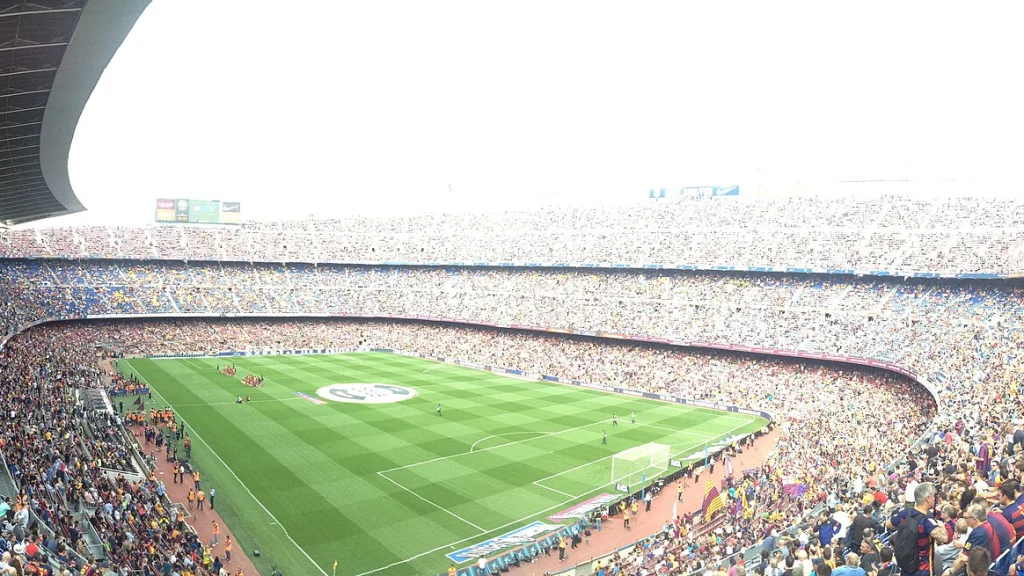 Wide view of a football match and crowd inside Camp Nou in Barcelona