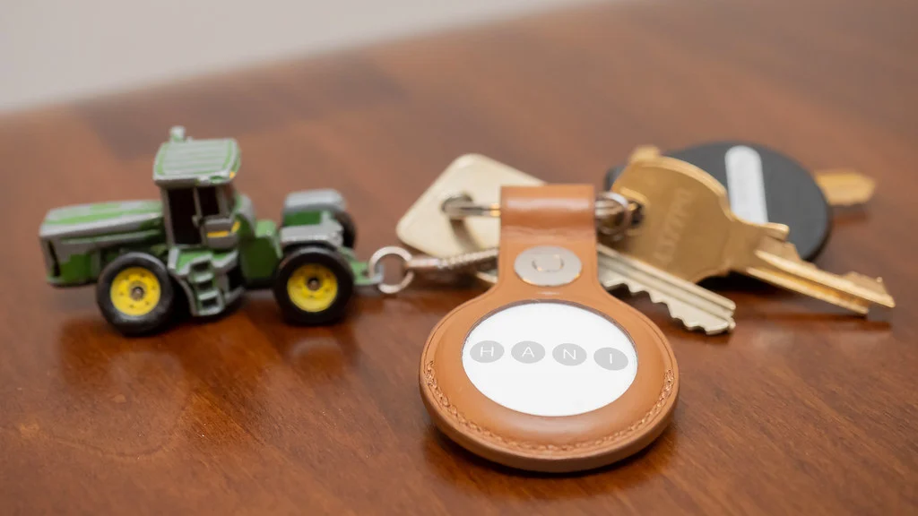 Apple AirTag Bluetooth tracker attached to a set of keys